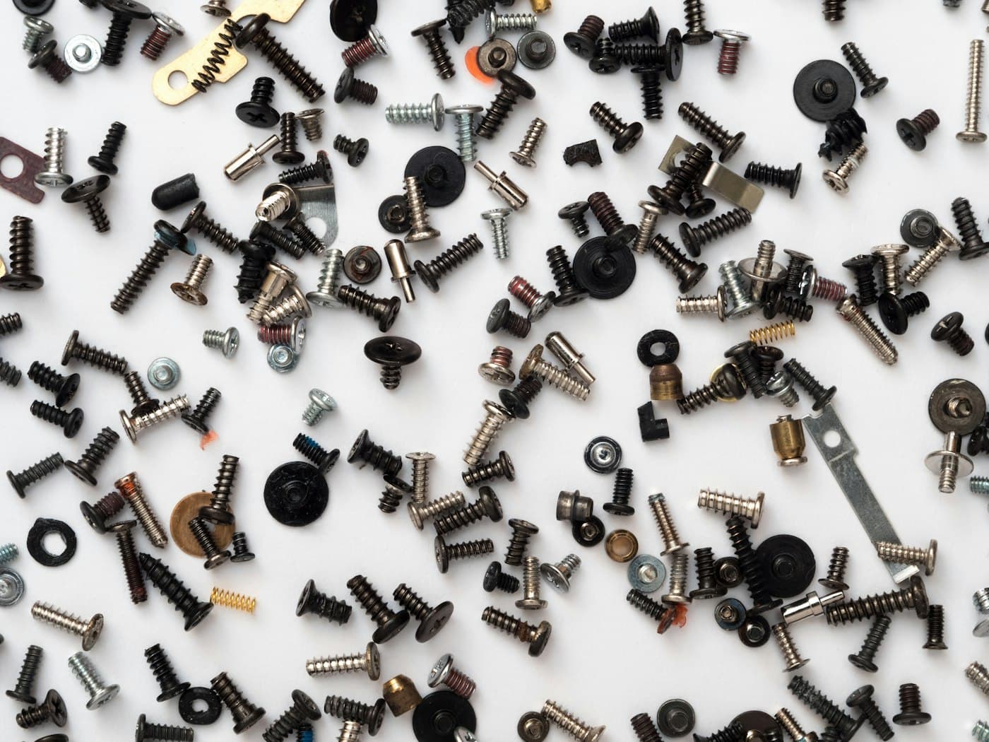 Assorted small screws and parts used in device repair